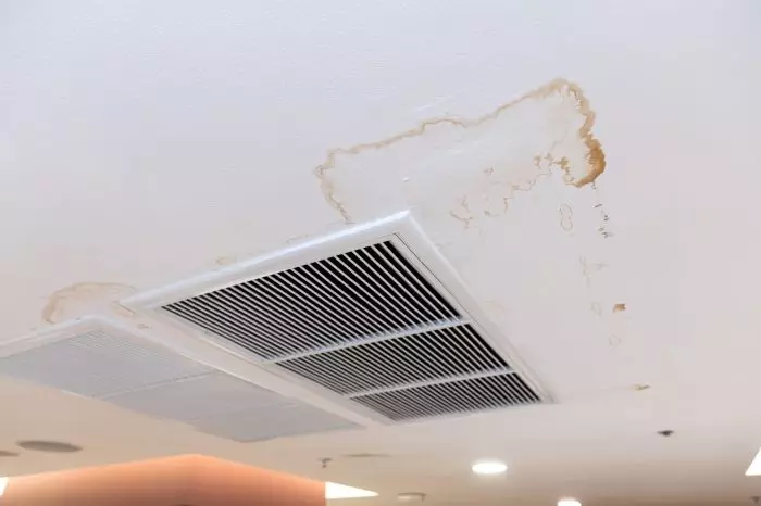 Air conditioner has water drop leak on air grille and mold on ceiling stain and cracked.